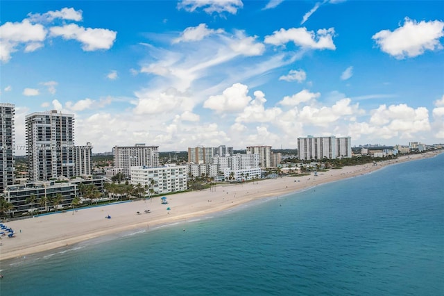 bird's eye view featuring a water view and a view of the beach