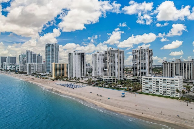 aerial view featuring a water view and a beach view