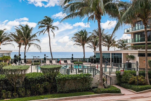 view of swimming pool with a water view