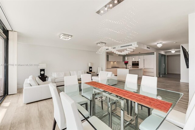 dining space featuring light wood-type flooring