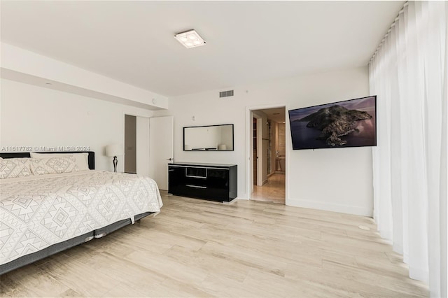 bedroom with wood-type flooring