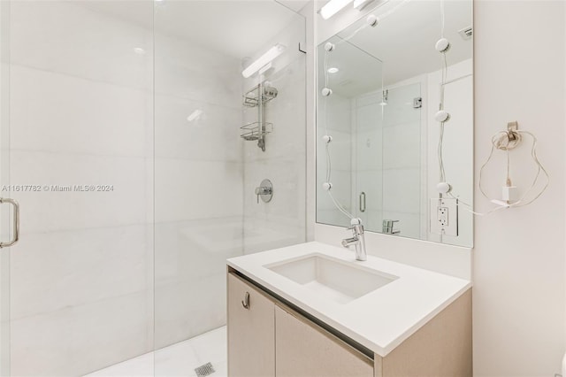 bathroom featuring vanity and walk in shower