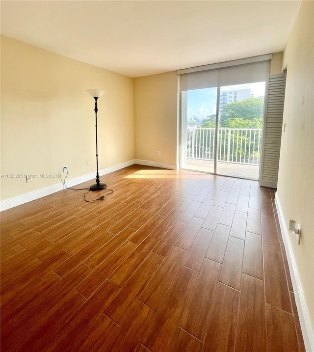 spare room featuring hardwood / wood-style flooring