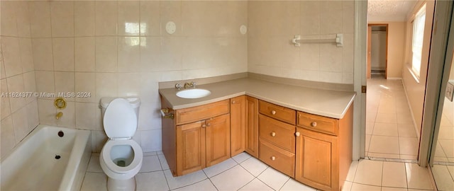 bathroom featuring vanity, tile patterned flooring, and tile walls