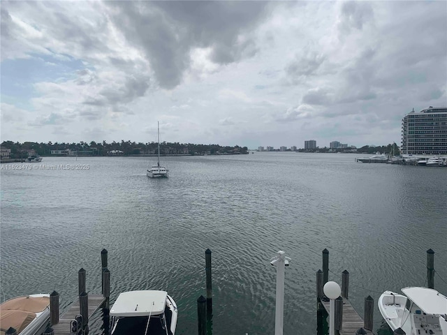 view of dock featuring a water view and central AC unit