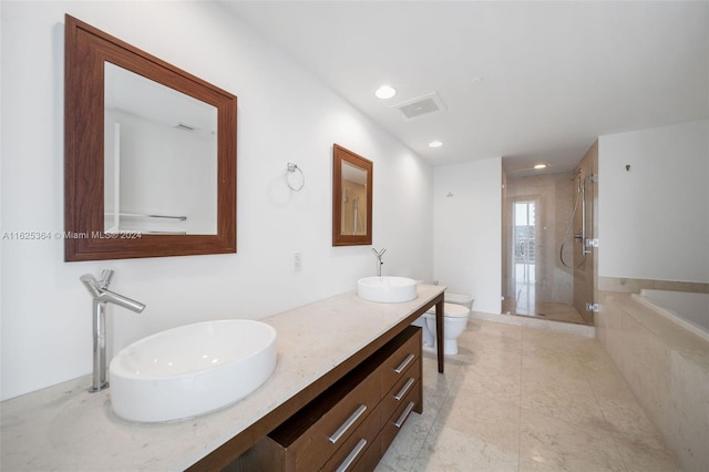 full bathroom with vanity, toilet, and shower with separate bathtub