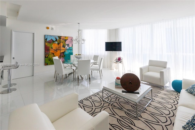 tiled living room featuring a chandelier