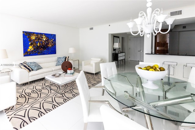 dining space with an inviting chandelier and light tile patterned floors