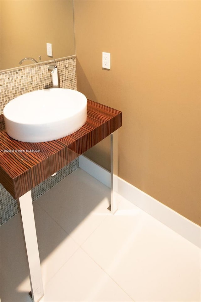 bathroom with sink and tile patterned flooring