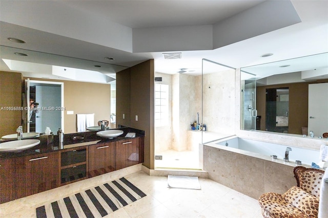 bathroom with plus walk in shower, a wealth of natural light, tile patterned flooring, and dual bowl vanity