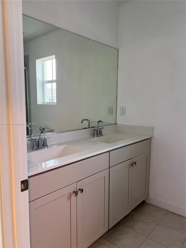 bathroom featuring tile patterned flooring and vanity