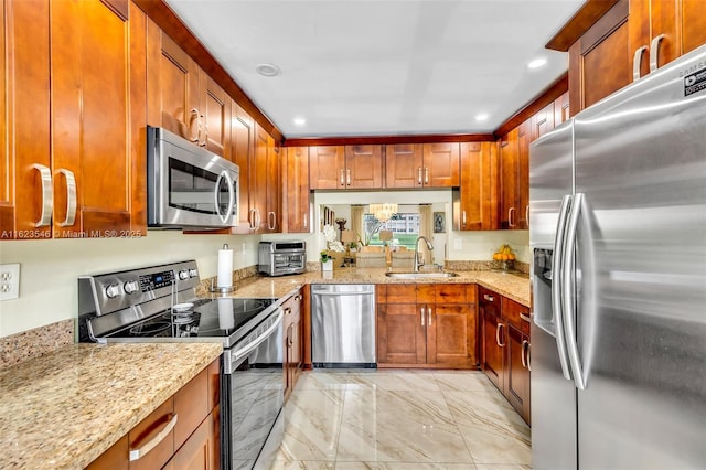 2606 NW 104th Ave Unit 106, Sunrise, FL 33322 - kitchen featuring light stone countertops, appliances with stainless steel finishes, a sink, marble finish floor, and recessed lighting