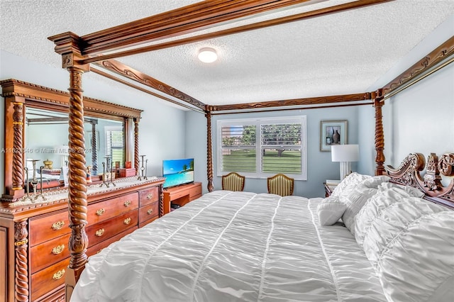 bedroom featuring a textured ceiling and ornamental molding