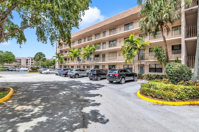 2606 NW 104th Ave Unit 106, Sunrise, FL 33322 - view of building exterior featuring uncovered parking