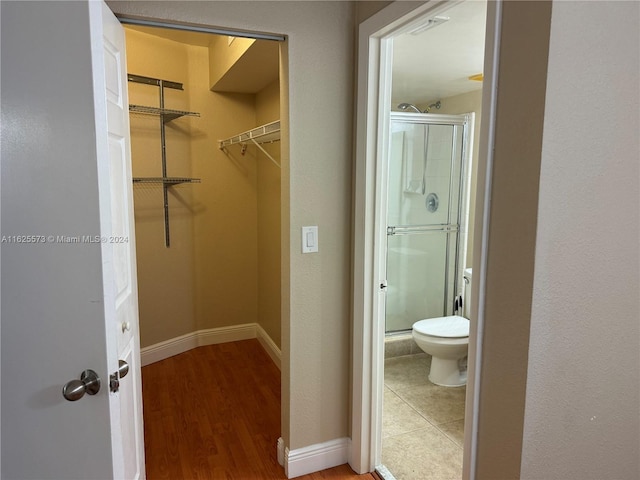 walk in closet featuring wood-type flooring