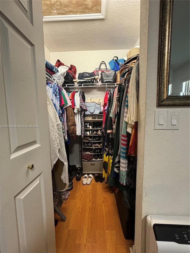 spacious closet featuring hardwood / wood-style floors