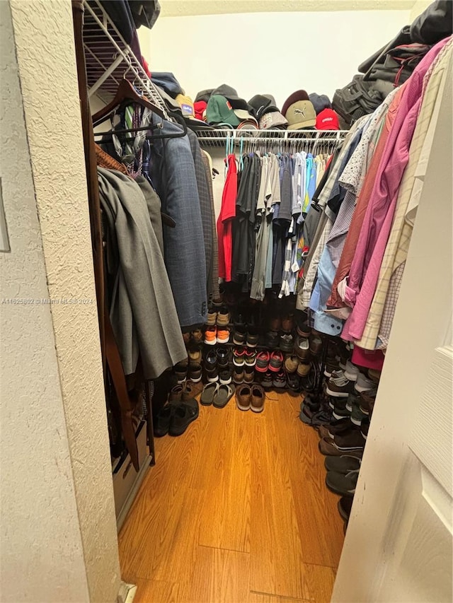 spacious closet featuring hardwood / wood-style floors