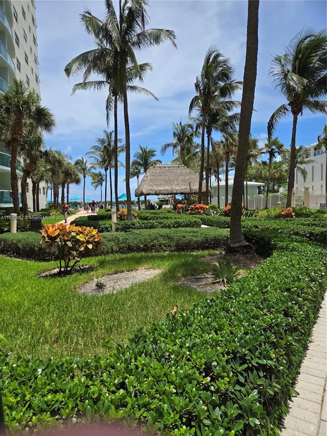 view of home's community with a lawn and a gazebo