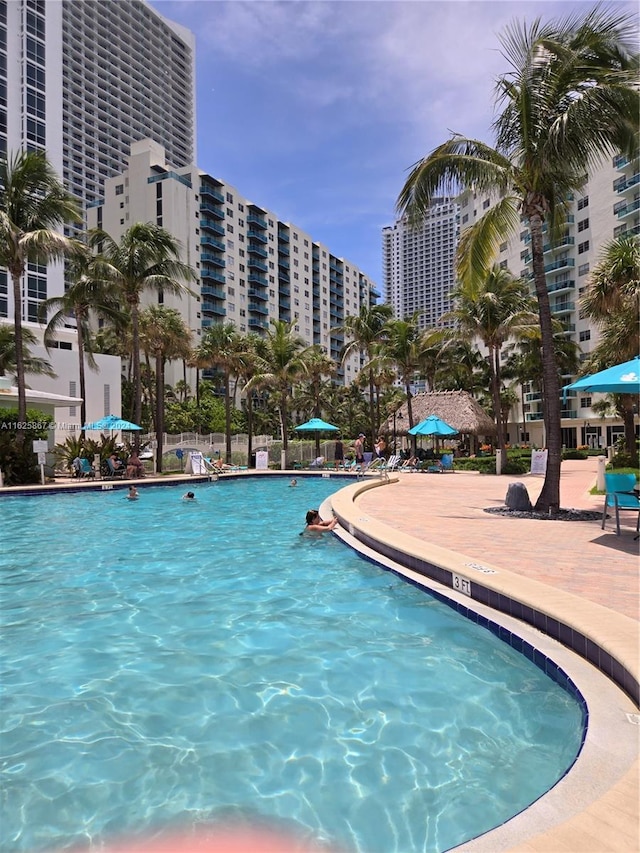 view of swimming pool featuring a view of city