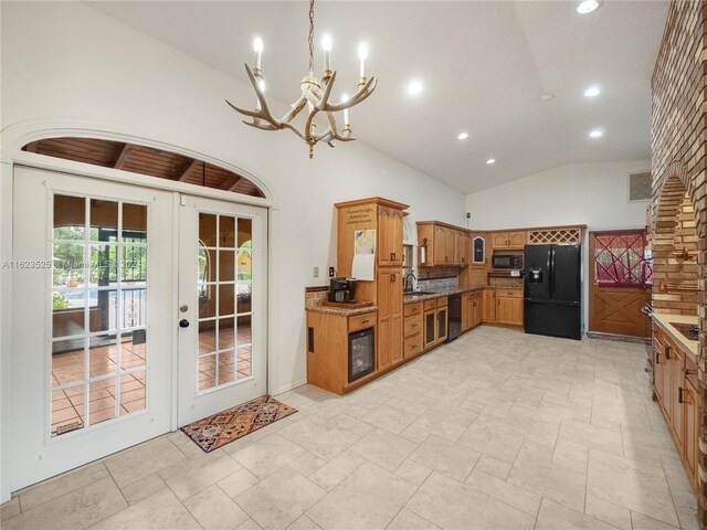 kitchen featuring black appliances, high vaulted ceiling, sink, french doors, and light tile patterned floors