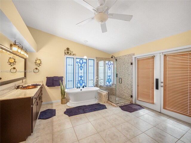 bathroom with independent shower and bath, tile patterned floors, vanity, and ceiling fan