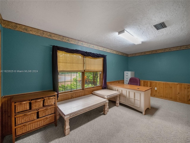 carpeted bedroom featuring a textured ceiling