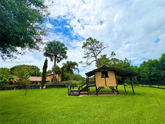 view of property's community with a yard