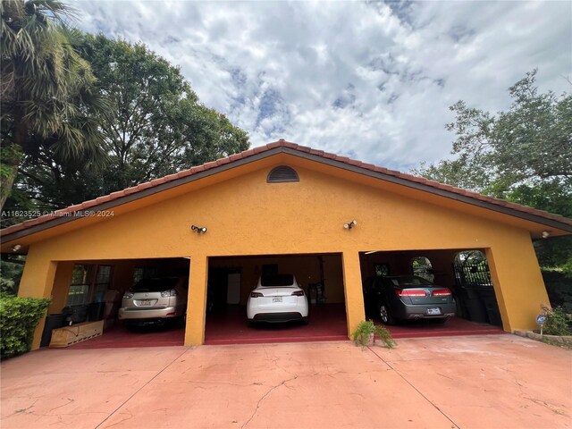 view of side of home with a garage