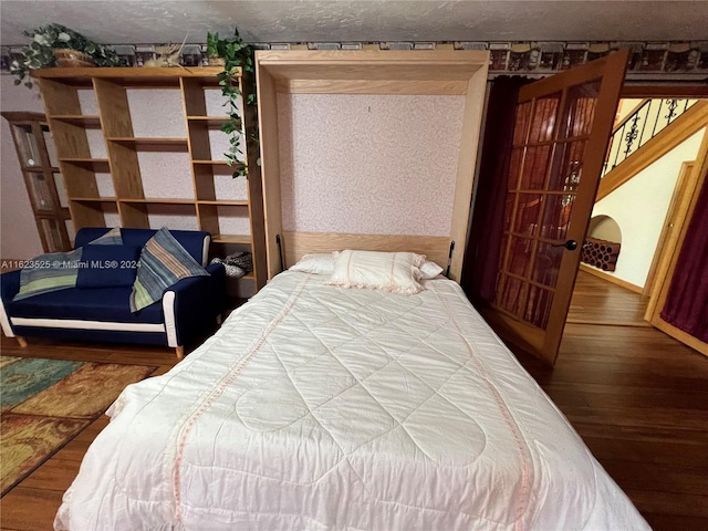 bedroom featuring hardwood / wood-style flooring