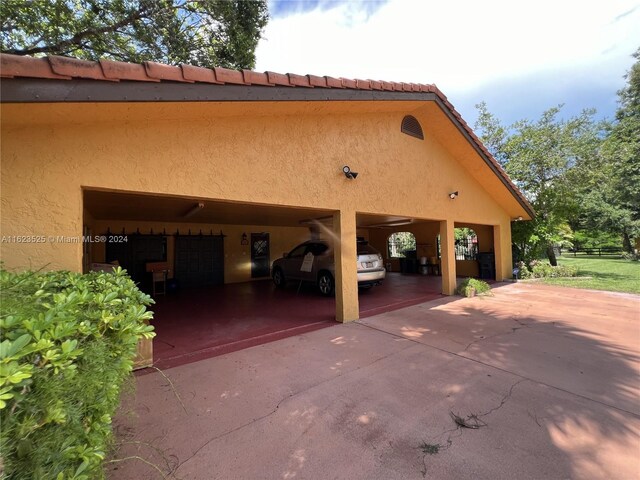 view of property exterior with a carport