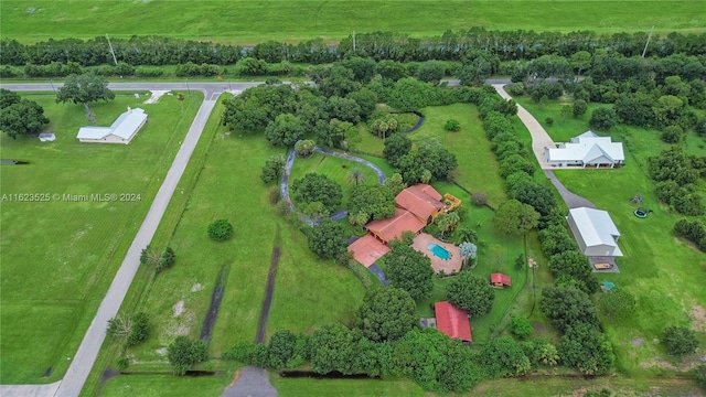 birds eye view of property with a rural view