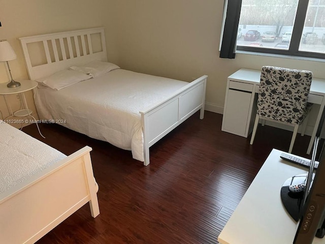 bedroom featuring dark hardwood / wood-style flooring