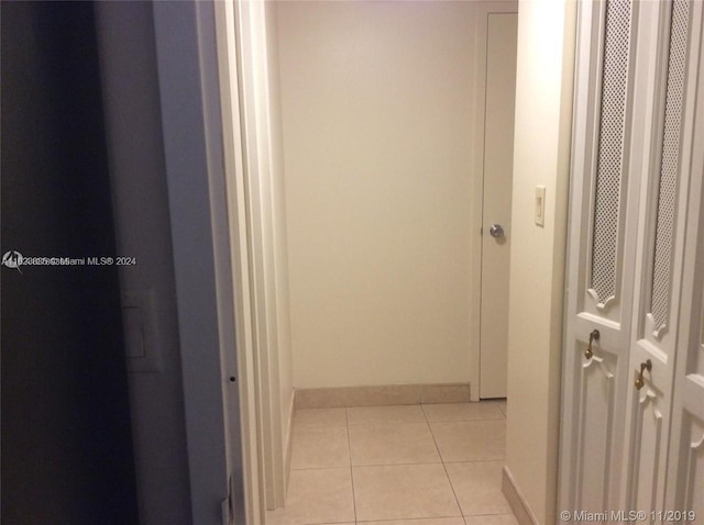 hallway featuring light tile patterned floors