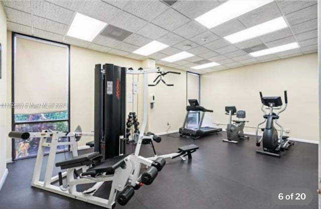 gym featuring a paneled ceiling