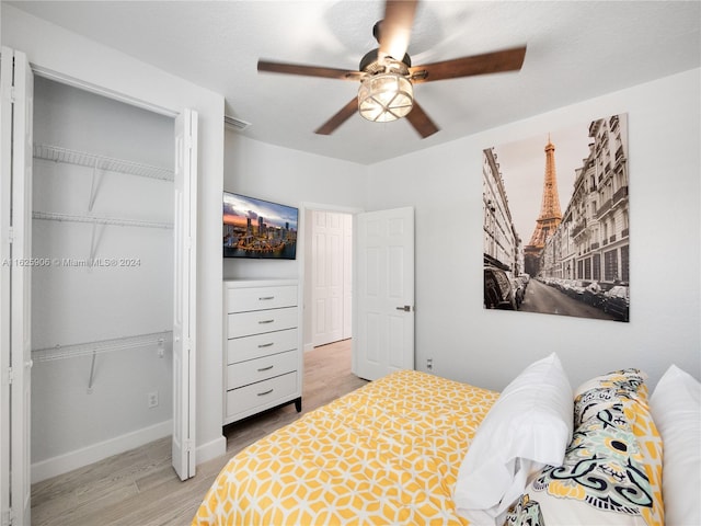 bedroom with light wood-type flooring and ceiling fan