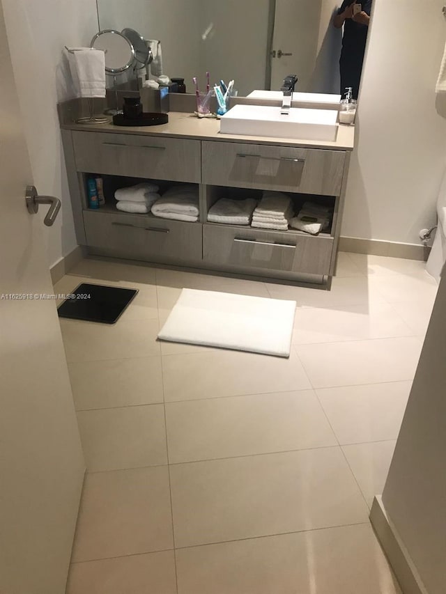 bathroom with tile patterned flooring and vanity