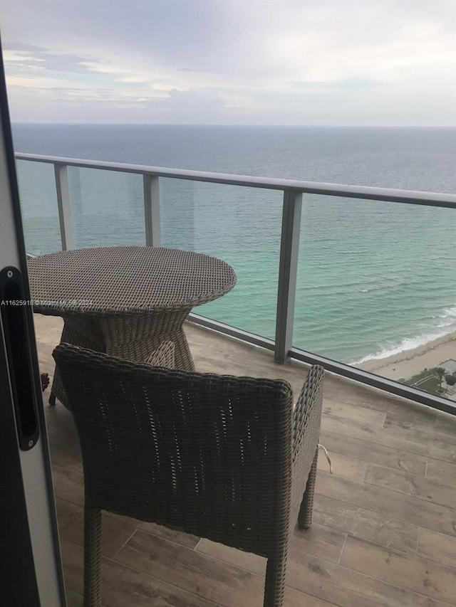 balcony featuring a water view