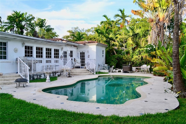 view of pool featuring a patio area