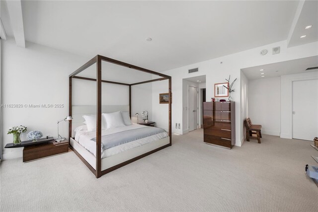 bedroom featuring light colored carpet