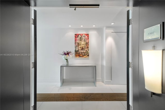 hallway featuring light tile patterned floors