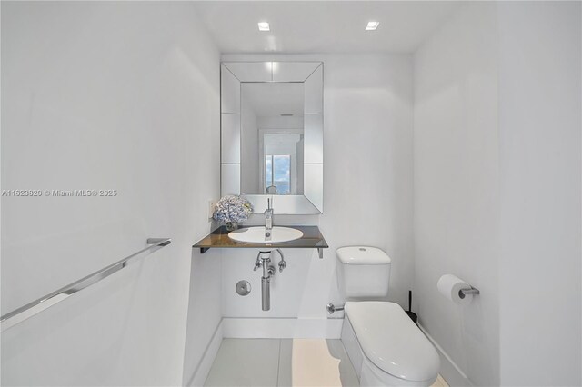 bathroom with sink and toilet