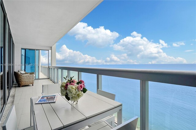 balcony featuring a water view