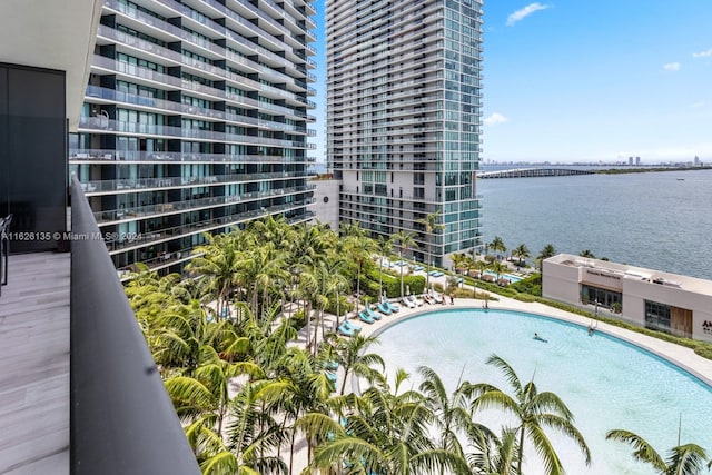 view of pool with a water view