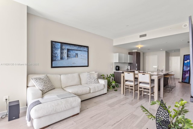 480 NE 31st St Unit 1005, Miami, FL 33137 - living room featuring light wood-type flooring