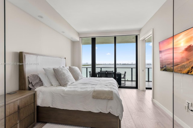 480 NE 31st St Unit 1005, Miami, FL 33137 - bedroom with wood finished floors and access to exterior