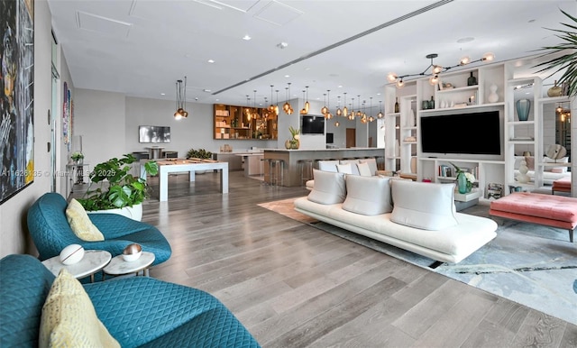 480 NE 31st St Unit 1005, Miami, FL 33137 - living room with wood finished floors, recessed lighting, and attic access