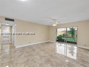 spare room featuring ceiling fan