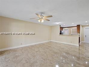 spare room featuring ceiling fan