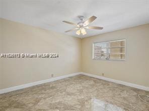 unfurnished room featuring ceiling fan