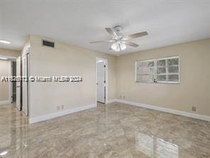 spare room featuring ceiling fan